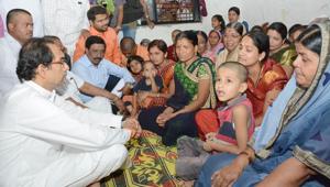 Shiv Sena chief Uddhav Thackeray (extreme left) on Wednesday met families of the two Shiv Sena leaders who were shot dead earlier this month in Ahmednagar district.(HT PHOTO) Shiv Sena chief Uddhav Thackeray (extreme left) on Wednesday met families of the two Shiv Sena leaders who were shot dead earlier this month in Ahmednagar district.(HT PHOTO)