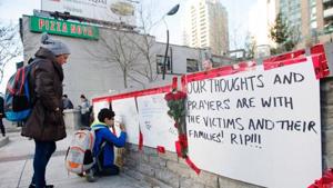 People sign a memorial after a driver plowed a rented van along a crowded sidewalk, killing multiple people and injuring others, Monday, April 23, 2018, in Toronto.(AP) People sign a memorial after a driver plowed a rented van along a crowded sidewalk, killing multiple people and injuring others, Monday, April 23, 2018, in Toronto.(AP)