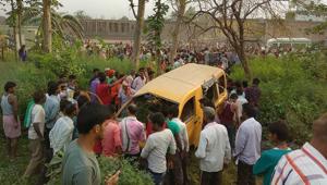 People gather around the mangled school van after it collided with a moving train in Kushinagar, Uttar Pradesh, on Thursday morning.(PTI Photo) People gather around the mangled school van after it collided with a moving train in Kushinagar, Uttar Pradesh, on Thursday morning.(PTI Photo)