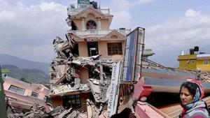 A woman stands amid the debris caused by a fresh earthquake in Nepal.(HT File Photo) A woman stands amid the debris caused by a fresh earthquake in Nepal.(HT File Photo)