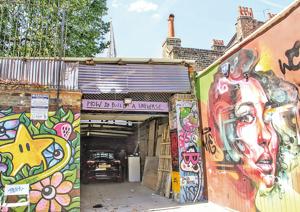 A garage off Brick Lane is decorated with colourful street art(Kalpana Sunder) A garage off Brick Lane is decorated with colourful street art(Kalpana Sunder)