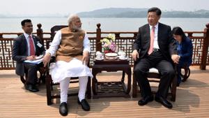 India's Prime Minister Narendra Modi and Chinese President Xi Jinping looking on in a house boat, at East Lake, in Wuhan on April 28.(AFP Photo) India's Prime Minister Narendra Modi and Chinese President Xi Jinping looking on in a house boat, at East Lake, in Wuhan on April 28.(AFP Photo)