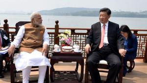 Prime Minister Narendra Modi speaks with Chinese President Xi Jinping as they take a boat ride on the East Lake in Wuhan, China.(Reuters Photo via PIB) Prime Minister Narendra Modi speaks with Chinese President Xi Jinping as they take a boat ride on the East Lake in Wuhan, China.(Reuters Photo via PIB)