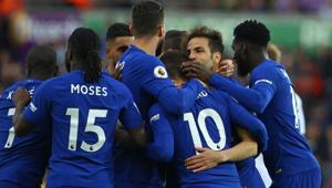 Chelsea midfielder Cesc Fabregas (2nd R) celebrates with teammates after scoring the opening goal of the English Premier League football match vs Swansea City at the Liberty Stadium in Swansea on Saturday.(AFP) Chelsea midfielder Cesc Fabregas (2nd R) celebrates with teammates after scoring the opening goal of the English Premier League football match vs Swansea City at the Liberty Stadium in Swansea on Saturday.(AFP)