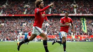Manchester United's Marouane Fellaini celebrates scoring their second goal against Arsenal in a Premier League match at Old Trafford on Sunday.(REUTERS)
