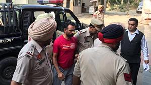 Dalit leader Harbhajan Suman being taken by police to a local court in Phagwara on Monday.(HT Photo) Dalit leader Harbhajan Suman being taken by police to a local court in Phagwara on Monday.(HT Photo)
