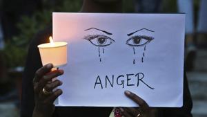 A woman stages protest against sexual violence against women, which has been on the rise in the country. Bihar Police have booked eight unknown persons after a video of a group of boys trying to strip a 14-year-old girl went viral on social media.(AP File Photo) A woman stages protest against sexual violence against women, which has been on the rise in the country. Bihar Police have booked eight unknown persons after a video of a group of boys trying to strip a 14-year-old girl went viral on social media.(AP File Photo)