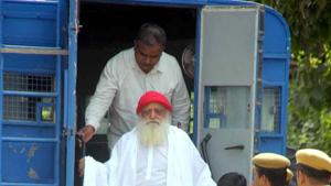 Asaram, accused of sexually assaulting a minor, being taken to a district session court in Jodhpur. If the higher courts don’t provide him relief, he’ll have to spend the rest of his life behind bars.(Ramji Vyas/Hindustan Times)