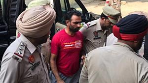 Dalit leader Harbhajan Suman being taken by police to a local court in Phagwara on Monday.(HT File) Dalit leader Harbhajan Suman being taken by police to a local court in Phagwara on Monday.(HT File)