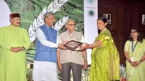 Chief minister Trivendra Singh Rawat (2nd from left) felicitates a representative of a gram panchayat for better performances during the first day of Summit on Climate Resilient Mountain Agriculture in Dehradun on Wednesday.(Vinay Santosh Kumar/HT Photo) Chief minister Trivendra Singh Rawat (2nd from left) felicitates a representative of a gram panchayat for better performances during the first day of Summit on Climate Resilient Mountain Agriculture in Dehradun on Wednesday.(Vinay Santosh Kumar/HT Photo)