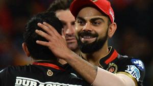 Royal Challengers Bangalore (RCB) captain Virat Kohli (R) hugs his teammate Yuzvendra Chahhal after his team won the 2018 Indian Premier League (IPL 2018) match against Mumbai Indians by 15 runs at The M Chinnaswamy Stadium in Bengaluru on Tuesday, May 1(AFP) Royal Challengers Bangalore (RCB) captain Virat Kohli (R) hugs his teammate Yuzvendra Chahhal after his team won the 2018 Indian Premier League (IPL 2018) match against Mumbai Indians by 15 runs at The M Chinnaswamy Stadium in Bengaluru on Tuesday, May 1(AFP)