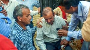 Husband of officer Shail Bala Sharma, who was shot dead by a hotel owner in Kasauli as she was supervising demolitions, mourns at his house.(PTI) Husband of officer Shail Bala Sharma, who was shot dead by a hotel owner in Kasauli as she was supervising demolitions, mourns at his house.(PTI)