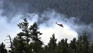 A helicopter fighting a wildfire in north-central Arizona.(AP Photo) A helicopter fighting a wildfire in north-central Arizona.(AP Photo)