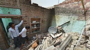 A man in Agra stands in his house that collapsed in the Wednesday’s powerful storm. Agra district bore the brunt of the storm that killed more than 100 people in north and west India.(PTI) A man in Agra stands in his house that collapsed in the Wednesday’s powerful storm. Agra district bore the brunt of the storm that killed more than 100 people in north and west India.(PTI)