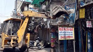 Authorities carry out demolition of illegal structures at Sadar Bazar in New Delhi on Friday.(PTI Photo) Authorities carry out demolition of illegal structures at Sadar Bazar in New Delhi on Friday.(PTI Photo)