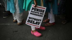 A woman stands with a placard during a protest against rapes, in New Delhi on May 5.(AP FILE) A woman stands with a placard during a protest against rapes, in New Delhi on May 5.(AP FILE)