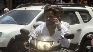In a fortnight, traffic police have caught 5,075 people using mobile phones while driving. In a fortnight, traffic police have caught 5,075 people using mobile phones while driving.
