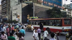 Pedestrians cross a street outside the UCO Bank headquarters in the BBD Bagh area of Kolkata, West Bengal, India.(Sanjit Das/Bloomberg) Pedestrians cross a street outside the UCO Bank headquarters in the BBD Bagh area of Kolkata, West Bengal, India.(Sanjit Das/Bloomberg)