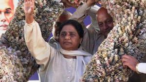 BSP supremo Mayawati being presented a garland of currency notes at party headquarters in Lucknow.(PTI File Photo)