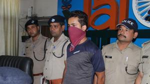 Police present Karan Shivpuri before media persons in Dehradun on Wednesday.(HT Photo)