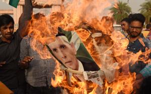 Youths burn a portrait of Mohammad Ali Jinnah in the state capital.(Subhankar Chakraborty/HT Photo) Youths burn a portrait of Mohammad Ali Jinnah in the state capital.(Subhankar Chakraborty/HT Photo)