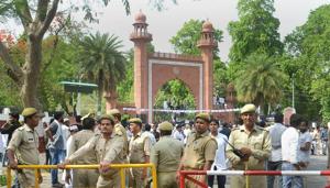 Security personnel stand guard as Aligarh Muslim University students stage a protest over Jinnah portrait issue outside the university gate in Aligarh.(PTI File Photo) Security personnel stand guard as Aligarh Muslim University students stage a protest over Jinnah portrait issue outside the university gate in Aligarh.(PTI File Photo)