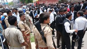 Lawyers and police at the site of the shooting in Allahabad on Thursday.(HT PHOTO) Lawyers and police at the site of the shooting in Allahabad on Thursday.(HT PHOTO)