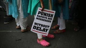 A protester stands with a placard during a protest in New Delhi.(AP Photo) A protester stands with a placard during a protest in New Delhi.(AP Photo)