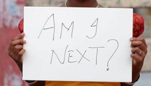 A woman in Kochi holds a placard denouncing the rise in sexual crimes against women across the country.(REUTERS File) A woman in Kochi holds a placard denouncing the rise in sexual crimes against women across the country.(REUTERS File)