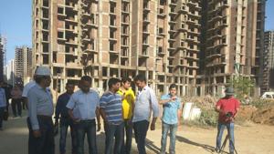 Homebuyers in Amrapali projects in Noida and company representatives inspect work at a project in March 2018. Homebuyers in Amrapali projects in Noida and company representatives inspect work at a project in March 2018.