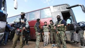 Fighters from Hayat Tahrir al-Sham and members of their families arrive in a rebel-held area of the Al-Eis crossing in Syria.(AFP File Photo) Fighters from Hayat Tahrir al-Sham and members of their families arrive in a rebel-held area of the Al-Eis crossing in Syria.(AFP File Photo)