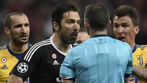 Juventus' Italian goalkeeper Gianluigi Buffon (2L) has been charged by UEFA for his comments on referee Michael Oliver after the Champions League quarterfinal against Real Madrid.(AFP)