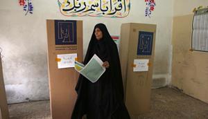 An Iraqi woman prepares to cast her vote in the country's parliamentary elections in Baghdad, Iraq, Saturday, May 12, 2018.(AP) An Iraqi woman prepares to cast her vote in the country's parliamentary elections in Baghdad, Iraq, Saturday, May 12, 2018.(AP)