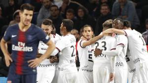 PSG's Yuri Berchiche, left, looks at his teammates as Rennes players celebrate scoring their side's second goal during their League 1 clash at the Parc des Princes stadium in Paris on Saturday.(AP) PSG's Yuri Berchiche, left, looks at his teammates as Rennes players celebrate scoring their side's second goal during their League 1 clash at the Parc des Princes stadium in Paris on Saturday.(AP)