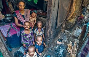 A family at one of the slums in M-East ward. Low immunisation rates with poor living conditions exposes the children and the families to a number of diseases.(Pratik Chorge/HT Photo) A family at one of the slums in M-East ward. Low immunisation rates with poor living conditions exposes the children and the families to a number of diseases.(Pratik Chorge/HT Photo)