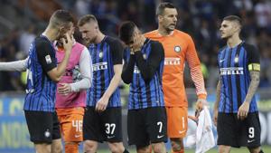 Inter Milan players leave the pitch at the end of the Serie A match vs Sassuolo at the San Siro stadium in Milan, Italy on May 12, 2018. Sassuolo won 2-1.(AP) Inter Milan players leave the pitch at the end of the Serie A match vs Sassuolo at the San Siro stadium in Milan, Italy on May 12, 2018. Sassuolo won 2-1.(AP)