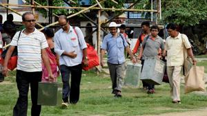 Polling officials carry ballot boxes and other polling materials for their respective polling stations for the third phase of panchayat elections in Murshidabad district in West Bengal.(PTI Photo) Polling officials carry ballot boxes and other polling materials for their respective polling stations for the third phase of panchayat elections in Murshidabad district in West Bengal.(PTI Photo)