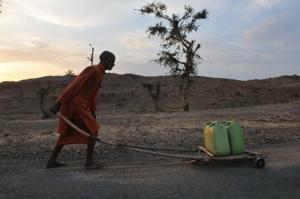 Bhopal, India - May 13, 2018: A priest carrying water for a temple in Budelkhand area near Prithvipur in Madhya Pradesh.(Mujeeb Faruqui/HT Photo) Bhopal, India - May 13, 2018: A priest carrying water for a temple in Budelkhand area near Prithvipur in Madhya Pradesh.(Mujeeb Faruqui/HT Photo)