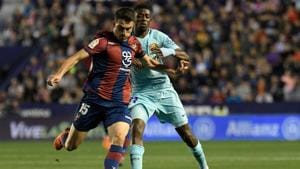 Levante's Sergio Postigo (L) vies with Barcelona's Ousmane Dembele during the La Liga match between Levante and Barcelona at the Ciutat de Valencia stadium in Valencia on May 13, 2018.(AFP) Levante's Sergio Postigo (L) vies with Barcelona's Ousmane Dembele during the La Liga match between Levante and Barcelona at the Ciutat de Valencia stadium in Valencia on May 13, 2018.(AFP)