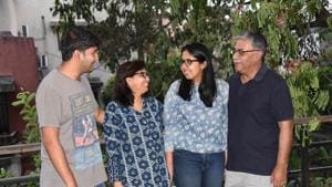 Ritisha Gupta celebrates her success with father Uday Gupta , mother Dhruba Gupta and brother Rajrishi Gupta in Pune on Sunday.(HT PHOTO)