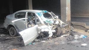 The car hit a street light and then crashed into a concrete pole built on the divider inside the grade separator located in Morwadi area of Chinchwad on Sunday.(HT Photo) The car hit a street light and then crashed into a concrete pole built on the divider inside the grade separator located in Morwadi area of Chinchwad on Sunday.(HT Photo)