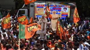 BJP supporters celebrate the party’s performance in the Karnataka assembly elections, in Bengaluru on Tuesday.(Arijit Sen / HT Photo) BJP supporters celebrate the party’s performance in the Karnataka assembly elections, in Bengaluru on Tuesday.(Arijit Sen / HT Photo)