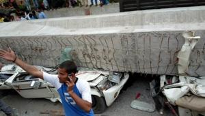 Cars crushed under the portion of the flyover that collapsed in Varanasi.(HT Photo) Cars crushed under the portion of the flyover that collapsed in Varanasi.(HT Photo)