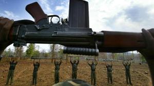 File photo of Maoist rebels raising their arms during an exercise at a temporary base in the Abujh Marh forests, in Chhattisgarh.(AP Photo) File photo of Maoist rebels raising their arms during an exercise at a temporary base in the Abujh Marh forests, in Chhattisgarh.(AP Photo)