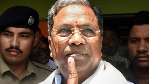 CM Siddaramaiah shows his inked finger after voting in the Karnataka assembly elections 2018, at Hundi village in Mysore. Counting of votes in Karnataka is underway on Tuesday.(PTI) CM Siddaramaiah shows his inked finger after voting in the Karnataka assembly elections 2018, at Hundi village in Mysore. Counting of votes in Karnataka is underway on Tuesday.(PTI)