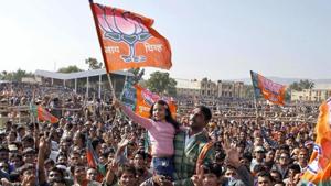 A child waves a BJP flag during a public meeting in Ajmer.(HT File Photo)