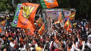 Bharatiya Janata Party supporters celebrate outside the BJP office after the Karnataka poll result in Bengaluru on Tuesday.(Arijit Sen/HT Photo) Bharatiya Janata Party supporters celebrate outside the BJP office after the Karnataka poll result in Bengaluru on Tuesday.(Arijit Sen/HT Photo)