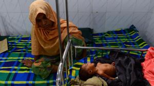 This photograph taken on April 9, 2018, shows a Rohingya mother sitting next to her sick child, who is treated at a Doctors Without Borders (MSF) clinic, at Kutupalong refugee camp in Bangladesh's Ukhia district.(AFP) This photograph taken on April 9, 2018, shows a Rohingya mother sitting next to her sick child, who is treated at a Doctors Without Borders (MSF) clinic, at Kutupalong refugee camp in Bangladesh's Ukhia district.(AFP)