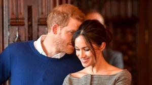 Britain's Prince Harry whispers to Meghan Markle as they watch a performance by a Welsh choir in the banqueting hall during a visit to Cardiff Castle in Cardiff, Britain.(Reuters File Photo) Britain's Prince Harry whispers to Meghan Markle as they watch a performance by a Welsh choir in the banqueting hall during a visit to Cardiff Castle in Cardiff, Britain.(Reuters File Photo)