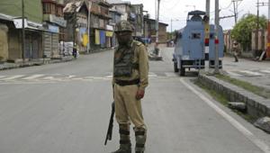 A paramilitary soldier stands guard at a temporary check point. Last year, there were a series of bank robberies in Kashmir and a majority of them targeted the J&K Bank.(AP File Photo) A paramilitary soldier stands guard at a temporary check point. Last year, there were a series of bank robberies in Kashmir and a majority of them targeted the J&K Bank.(AP File Photo)